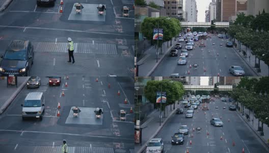 在洛杉矶市中心十字路口指挥车辆的交警。交通员指挥交通高清在线视频素材下载