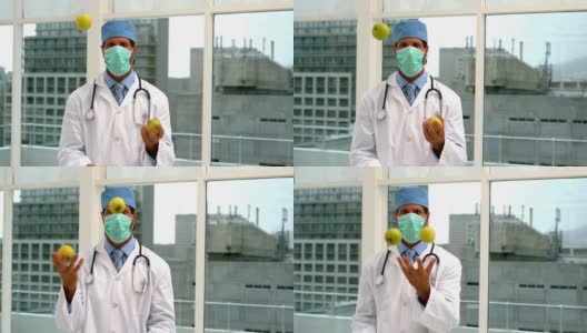 戴面具的医生耍绿苹果高清在线视频素材下载
