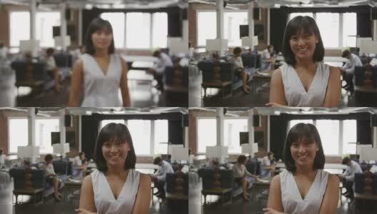年轻女商人的肖像在办公室拍摄的R3D高清在线视频素材下载