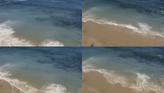 完美的空中拍摄的马里布加州海滩与白色的海浪撞击的沙子从直升飞机的观点显示的大海和海岸线在美国洛杉矶高清在线视频素材下载