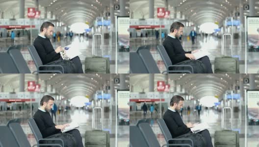 旅客在机场候机室看杂志高清在线视频素材下载