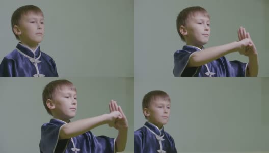 少年在武术中通过握拳来表现传统问候。武术高清在线视频素材下载
