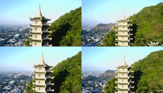 缩小在城市山上灯火通明的佛寺宝塔高清在线视频素材下载