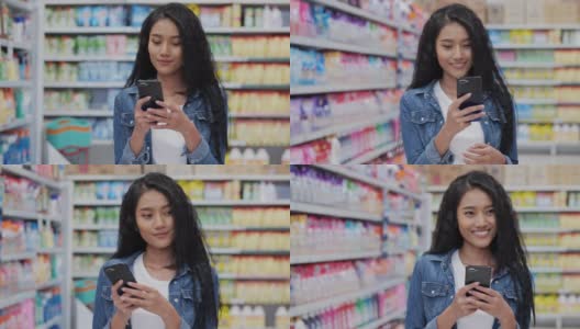 美女在超市用智能手机微笑研究产品细节。购物，客户，技术和生活理念。高清在线视频素材下载