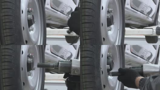轮胎服务。自动紧固车轮螺栓高清在线视频素材下载