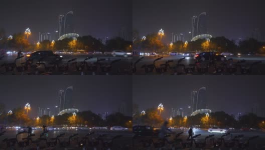 夜景时间照亮成都市区交通街道自行车租赁停车全景4k中国高清在线视频素材下载
