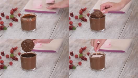 冰淇淋蘸巧克力酱和坚果。巧克力酱冰淇淋高清在线视频素材下载
