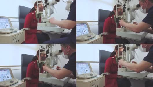 眼科医生在LASIK手术后检查病人的眼睛高清在线视频素材下载
