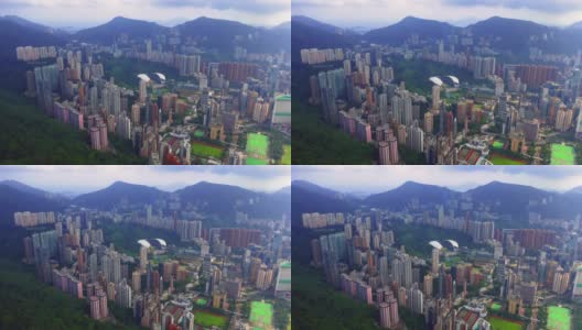 空中俯瞰香港市中心。亚洲智慧城市的金融区和商业中心。摩天大楼和高耸的现代建筑在中午。高清在线视频素材下载