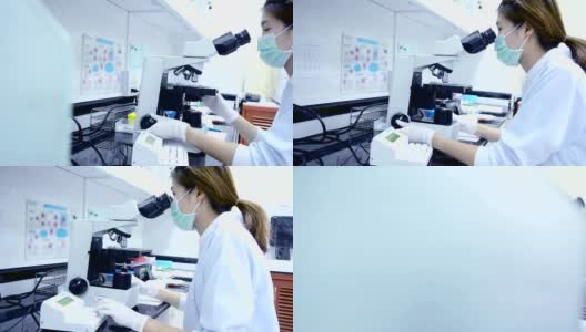 科学家在实验室里观察显微镜的多莉镜头高清在线视频素材下载