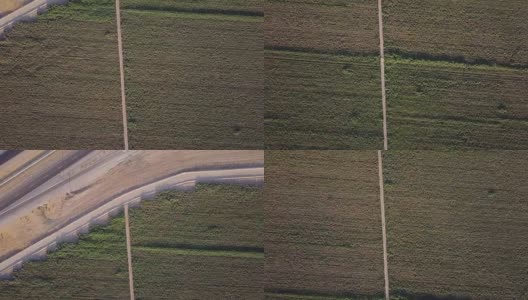 4K鸟瞰图的农田在圣华金山谷与I-5高清在线视频素材下载