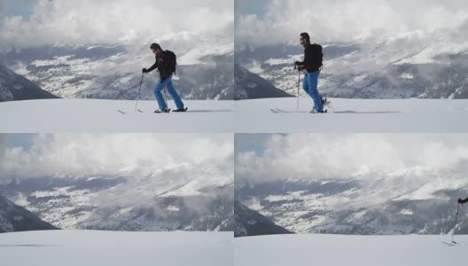 人沿雪岭上行上行景观。登山滑雪活动。冬季滑雪者在高山户外运动。侧视图。慢动作60p 4k视频高清在线视频素材下载