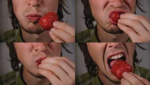 残忍的男人正在吃多汁的草莓特写。一个恶心的饥肠辘辘的家伙恶心地嚼着一颗成熟的大浆果高清在线视频素材下载