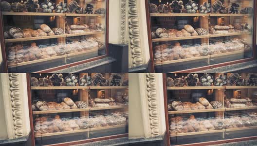 清晨，面包店的橱窗里有新鲜的面包。高清在线视频素材下载