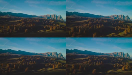 空中秋日的日出景色，以黄色落叶松和奥德尔盖斯勒山群为背景。意大利白云石阿尔卑斯山脉高清在线视频素材下载