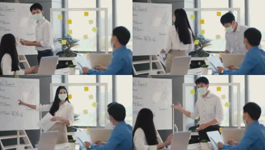 亚洲商人在医疗标志手握笔记纸会议与新的启动项目分享给业务团队。一群工人坐在桌边听演讲者讲话。商务会议的概念。高清在线视频素材下载