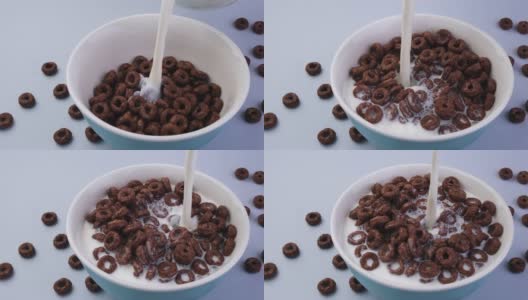 牛奶倒入一碗巧克力玉米圈中高清在线视频素材下载