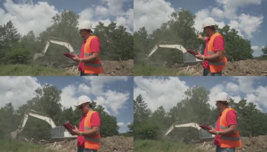 经理指导挖掘机司机收集建筑垃圾高清在线视频素材下载