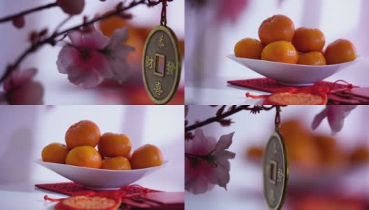 陈皮碗和红色的幸运袋作为中国新年的装饰元素。高清在线视频素材下载