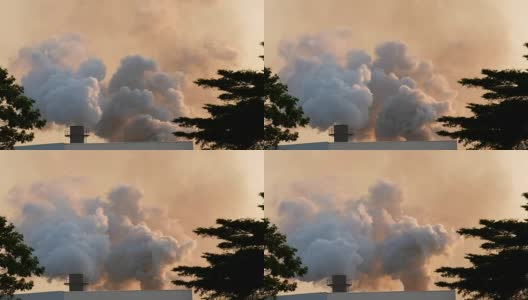 工业工厂正在燃烧，烟囱里冒出了污染的烟高清在线视频素材下载
