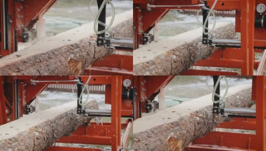 在木材生产工厂的锯床上切割松树原木的特写。在锯木厂加工和切割木材。木材厂的生产工艺。在动力机上锯木头高清在线视频素材下载