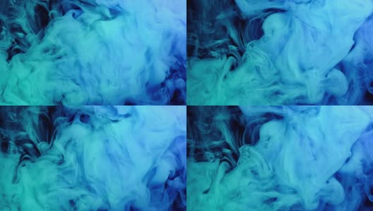 蓝色和绿色颜料滴在水中与黑色背景，抽象的颜色混合，墨颜料滴在水上。高清在线视频素材下载