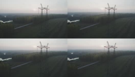 电力线就在风景如画的乡间河边高清在线视频素材下载
