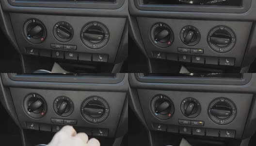 男人的手在车里按下自动空气再循环按钮。汽车高清在线视频素材下载