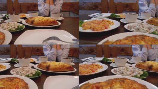 格鲁吉亚餐厅里的阿贾利安·哈切布里(Adjarian Khachapuri)，旁边是沙拉、煎蛋卷和咖啡高清在线视频素材下载