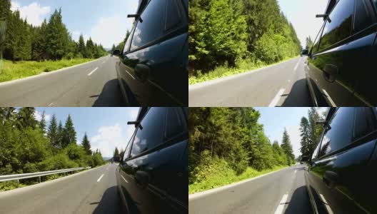 绿色汽车行驶在良好的道路在农村地区的木材高清在线视频素材下载