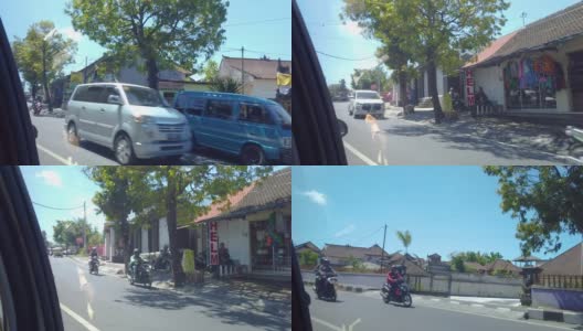巴厘岛之旅，车窗外的景色。巴厘岛路上的交通。高清在线视频素材下载