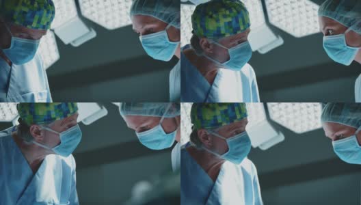 ICU外科医生与女护士讨论高清在线视频素材下载