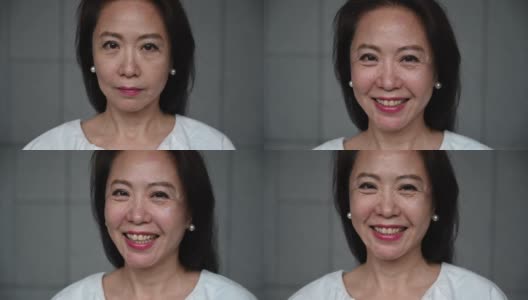近距离拍摄的高级中国妇女微笑的头像高清在线视频素材下载