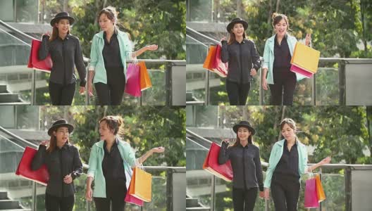 老两口年轻女子开心的时候拿着购物袋在那里花钱。高清在线视频素材下载