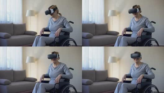 退休妇女在轮椅上戴着vr眼镜，享受游戏，科技高清在线视频素材下载