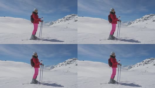 肖像微笑的白人女子滑雪者站在滑雪胜地的斜坡上高清在线视频素材下载