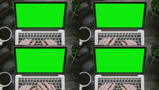 俯视图男性双手工作的笔记本电脑与绿色屏幕在白色的桌子上从上方高清在线视频素材下载