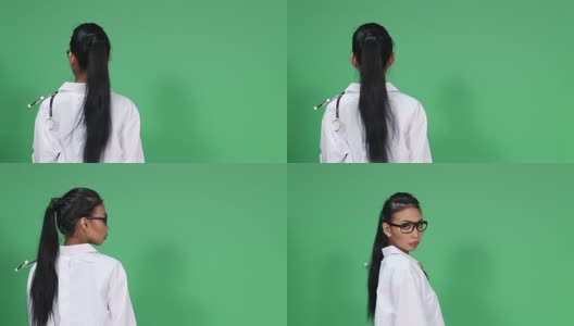 女亚裔皮肤黝黑医生与眼镜，听诊器，转身微笑和拇指欢呼高清在线视频素材下载
