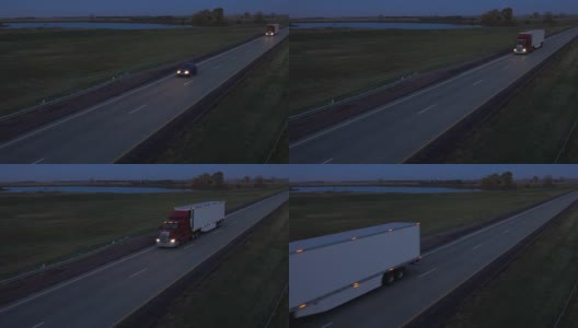 空中摄影:夜间在路上用集装箱运输货物的半挂车高清在线视频素材下载