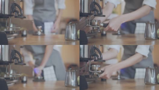 咖啡师用咖啡机磨咖啡豆。高清在线视频素材下载