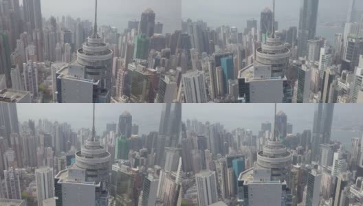 香港/ 2018年3月28日:香港城市鸟瞰图无人机在维多利亚港附近的摩天大楼、办公玻璃建筑周围飞行。混凝土丛林特大城市。商业中心城市景观城市生活高清在线视频素材下载