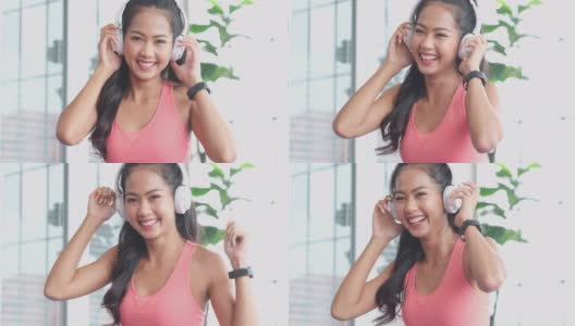 近距离的快乐年轻亚洲女人听音乐耳机和跳舞，而从家庭锻炼休息，4K分辨率，慢动作高清在线视频素材下载