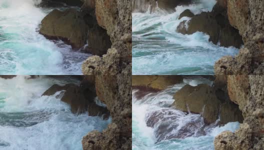 海浪拍打着岩石海岸，慢动作视频高清在线视频素材下载