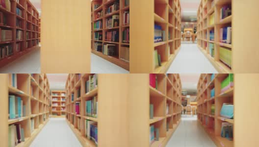 大学图书馆的书架上放着许多书。高清在线视频素材下载