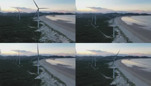 无人机拍摄的海滩上的风力发电场高清在线视频素材下载