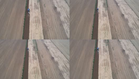 农用拖拉机耕地鸟瞰图高清在线视频素材下载