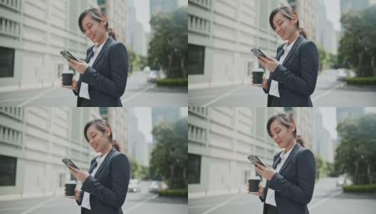 亚洲女商人在城市使用手机高清在线视频素材下载