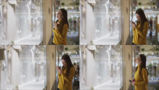 逛商场的女人，逛时装店的橱窗高清在线视频素材下载