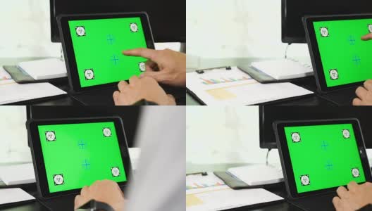 亚洲人手多利用平板电脑与空白绿色屏幕高清在线视频素材下载