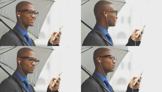 非洲黑人秃头商人使用耳麦耳机的移动电话高清在线视频素材下载